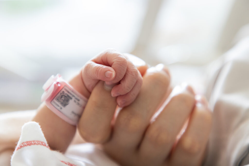 Newborn in NICU with oxygen support, symbolizing birth injury from lack of oxygen.
